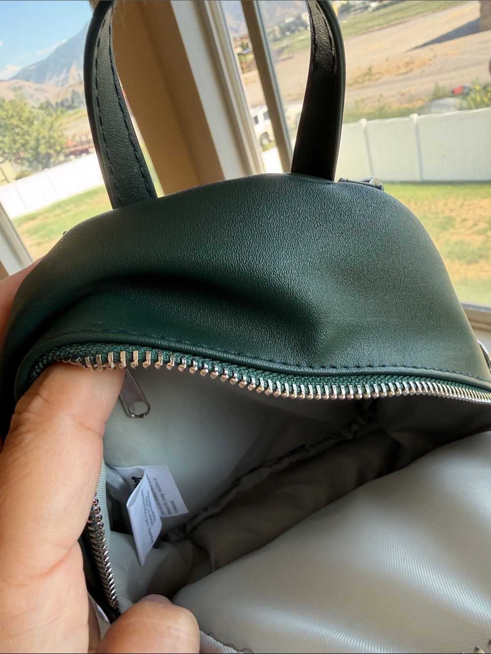 Green Mini Backpack Crossbody Bag with Pom Pom *never used - Picture 2 of 3